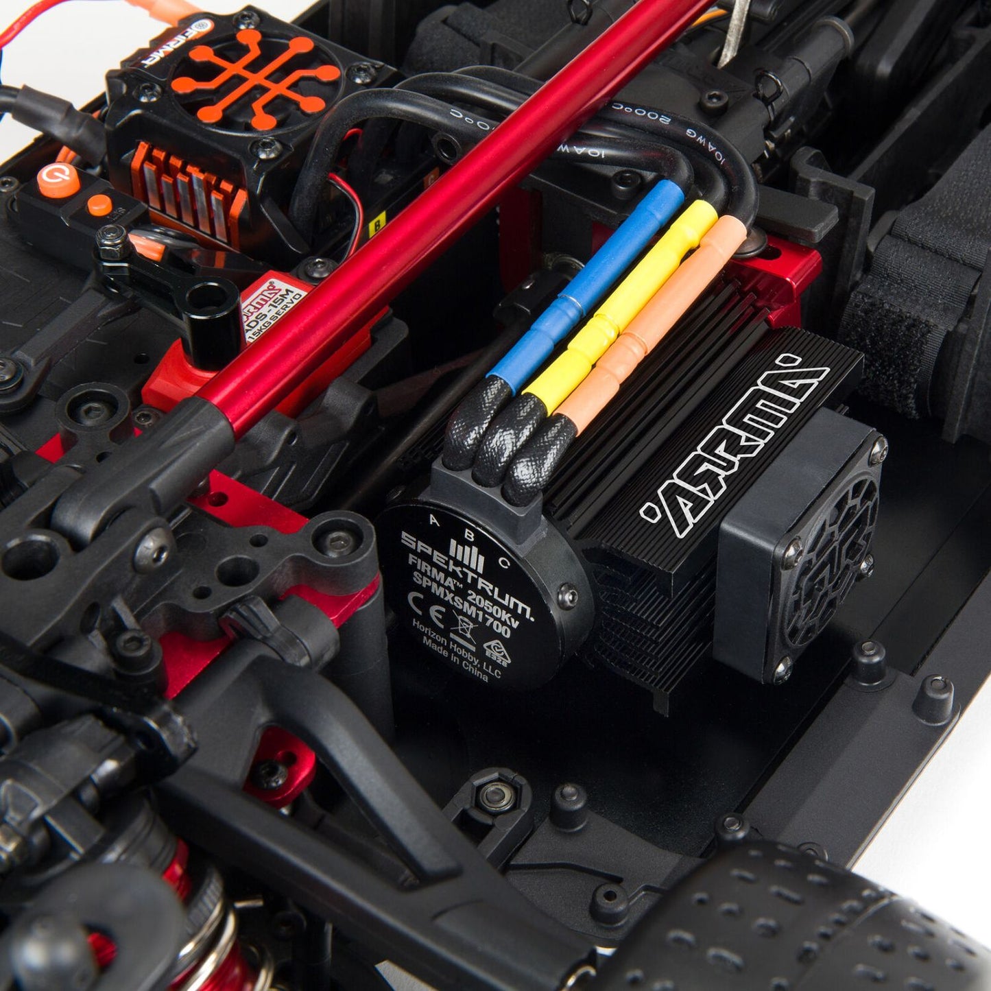 1/7 ARRMA INFRACTION 6S AVC 4X4 RTR- Close-up of a detailed model car motor and ESC