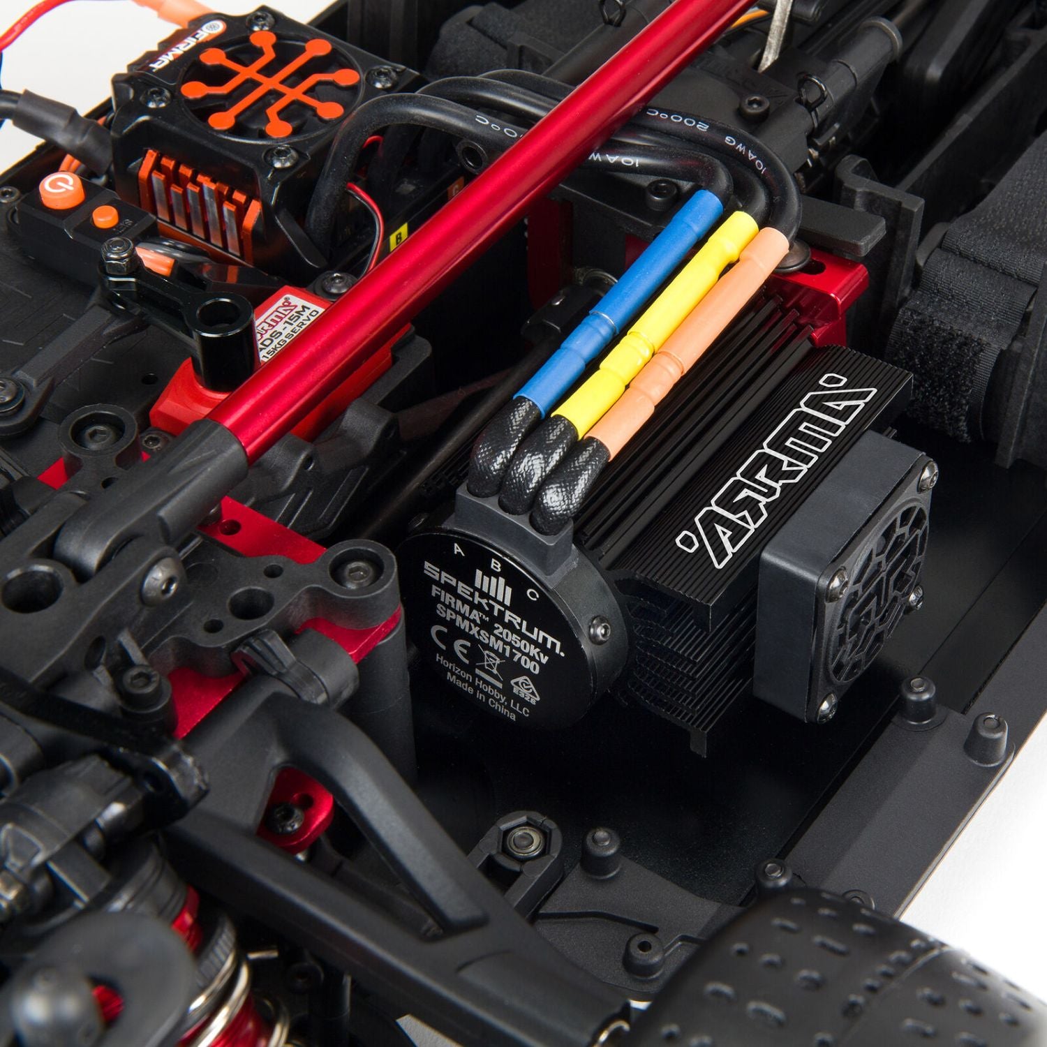 1/7 ARRMA INFRACTION 6S AVC 4X4 RTR- Close-up of a detailed model car motor and ESC