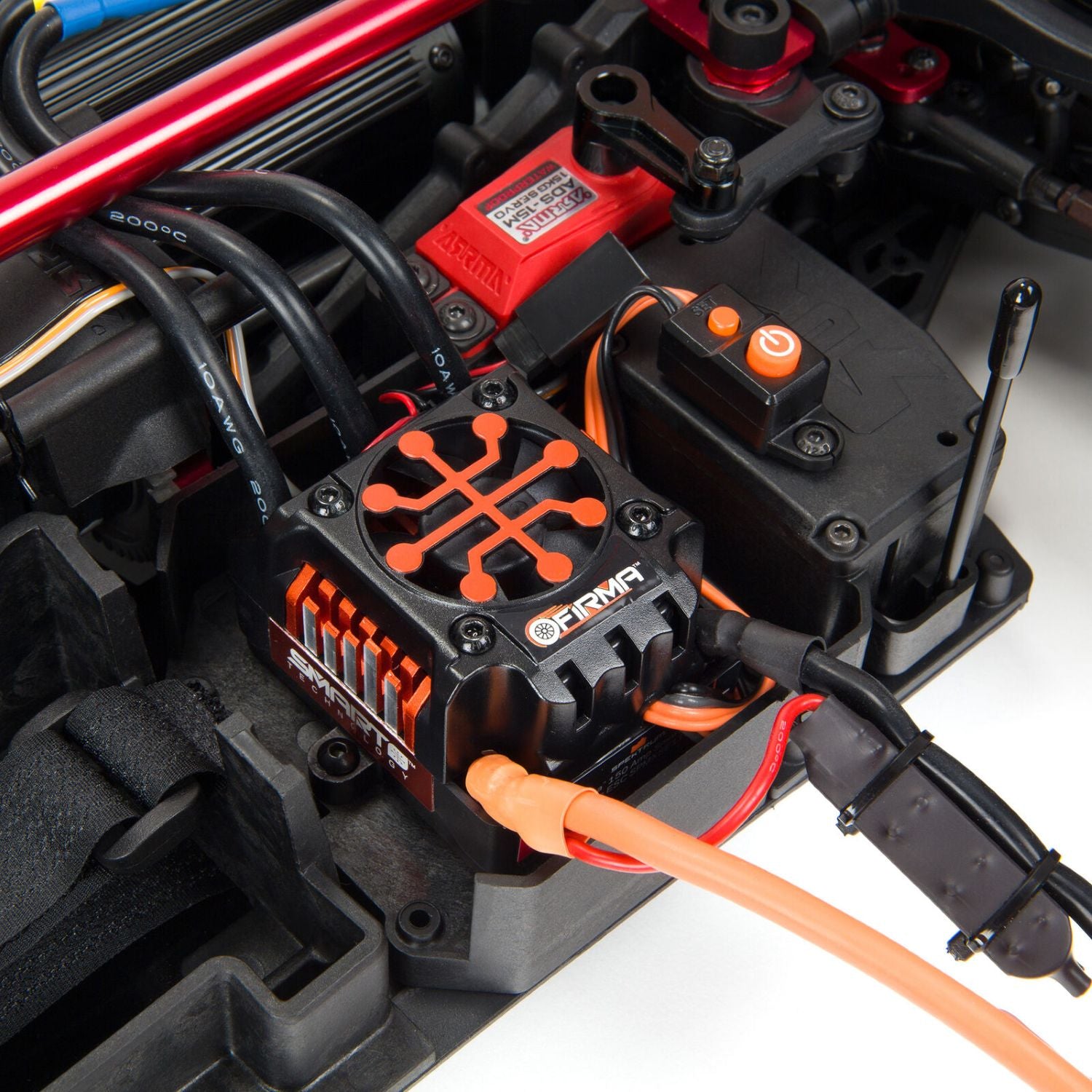 1/7 ARRMA INFRACTION 6S AVC 4X4 RTR - Close-up of a black and orange ESC FIRMA brand on a white background