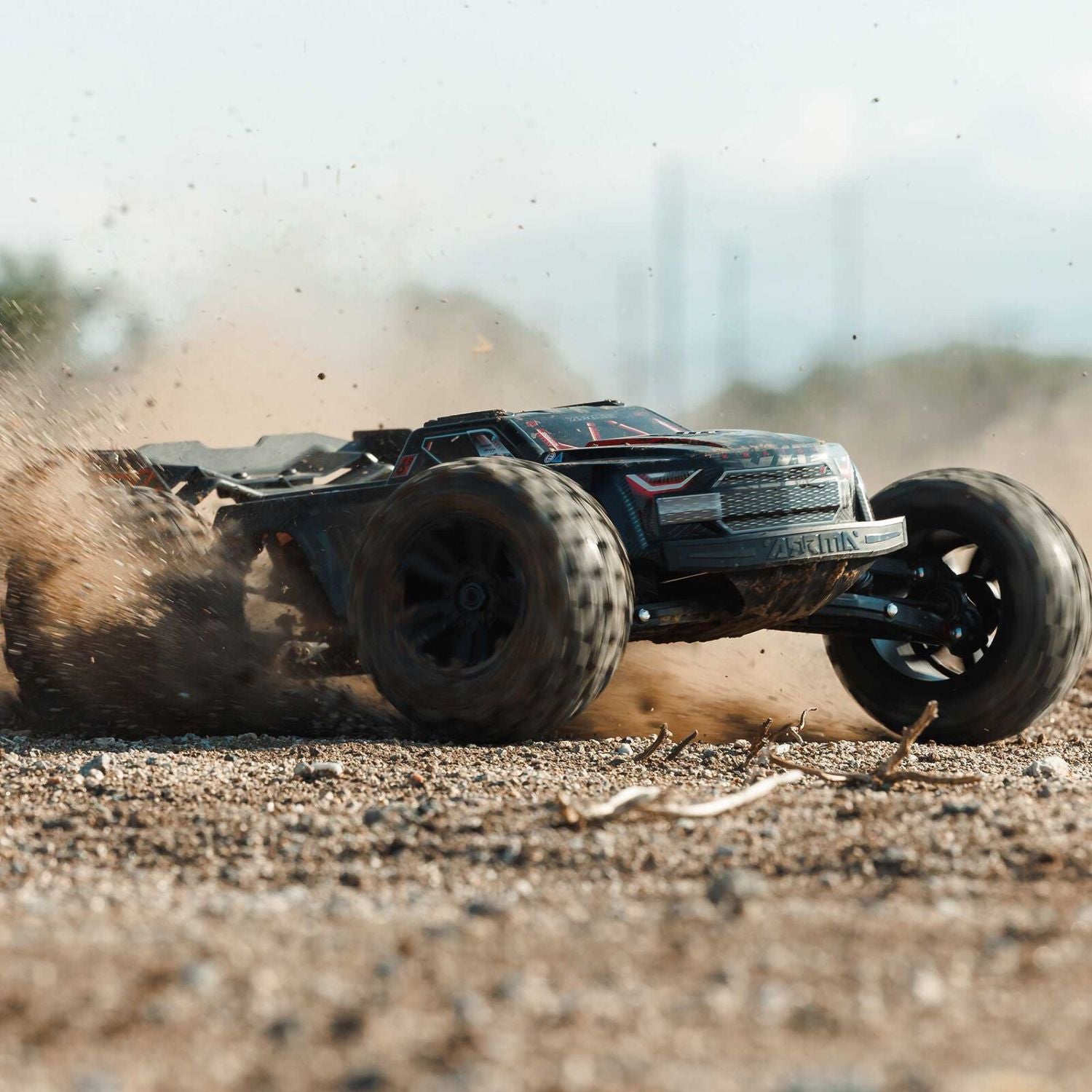 1/8 ARRMA KRATON 6S EXB 4X4 RTR Brushless Speed Truck - Off-road RC car driving on a dirt track with dust around