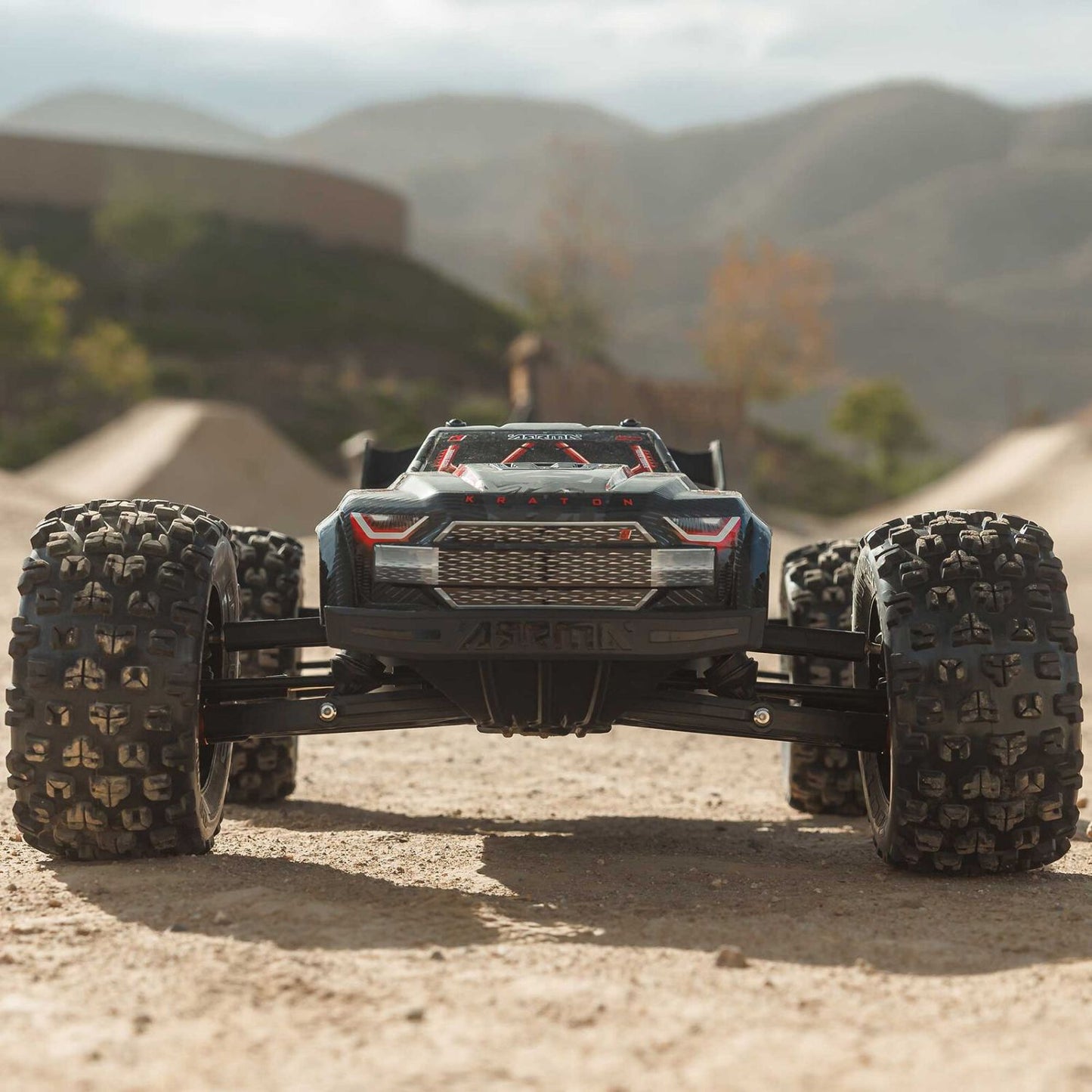 1/8 ARRMA KRATON 6S EXB 4X4 RTR Brushless Speed Truck- Off-road vehicle on a dirt track with mountains
