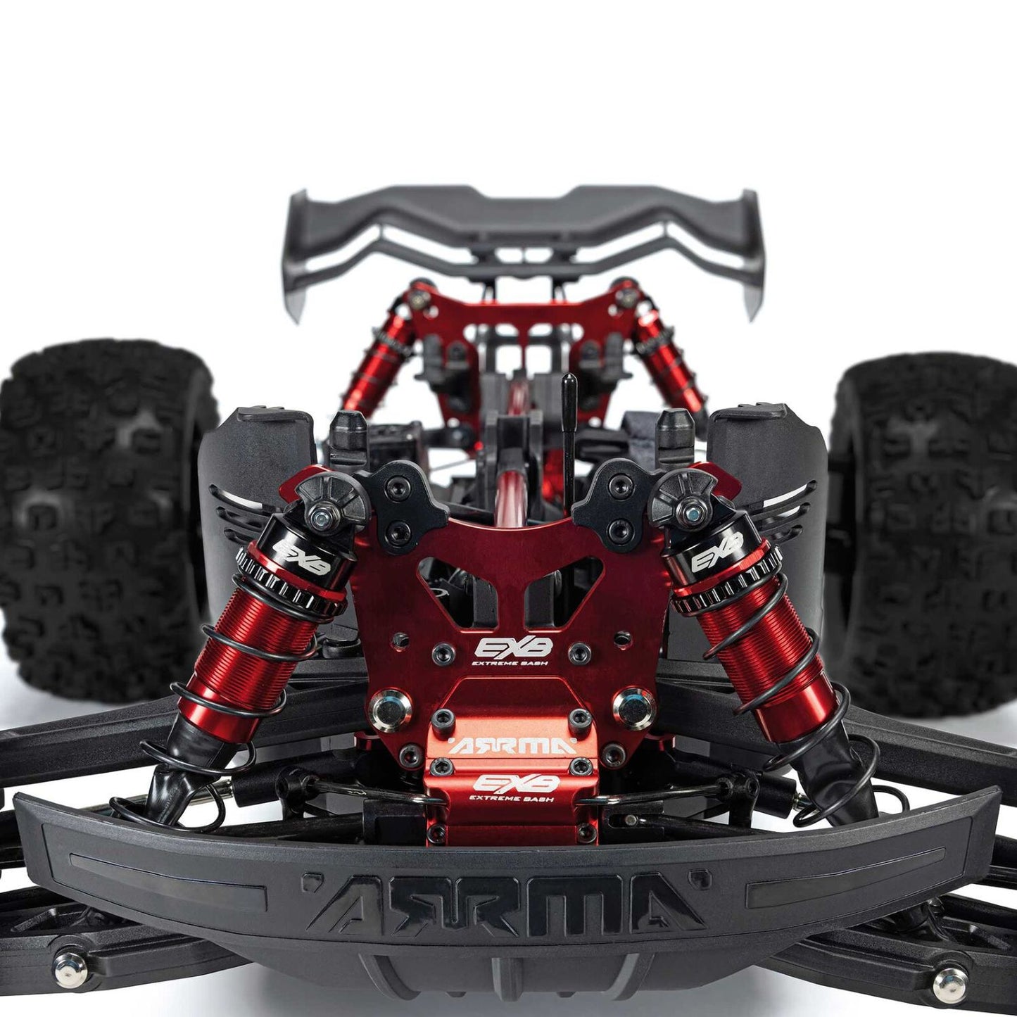 Close-up of a red and black RC car chassis with visible branding - 1/8 ARRMA KRATON 6S EXB 4X4 RTR Brushless Speed Truck